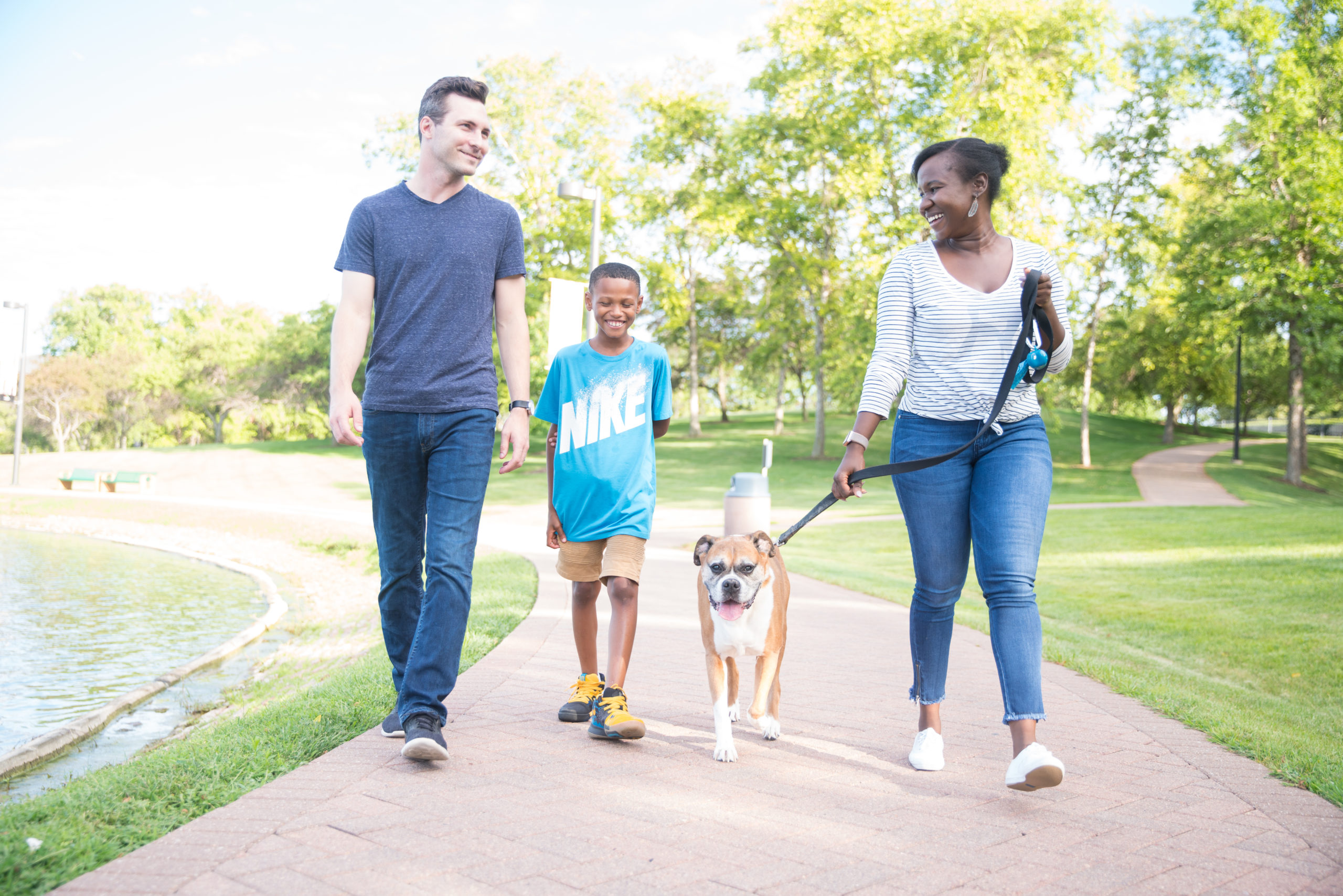 mentor, youth, parent, and their dog